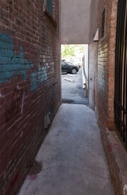 Fort Collins, CO.  woman in alley.